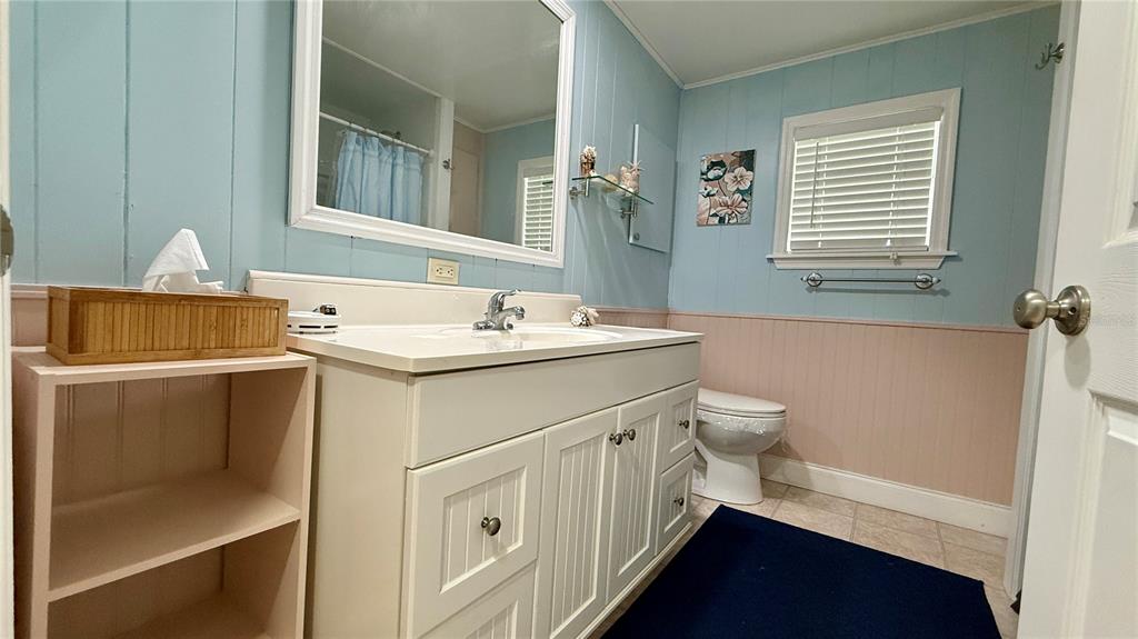 716 Blackburn Boulevard North Port, FL 34287 - Photo 28 of 48 a bathroom with a sink a toilet and a mirror