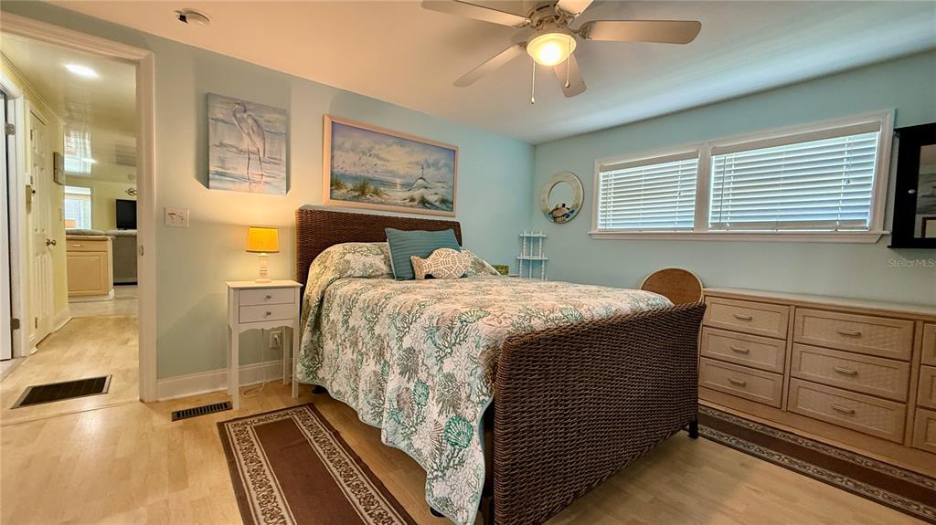 716 Blackburn Boulevard North Port, FL 34287 - Photo 33 of 48 a bedroom with a bed and a chandelier