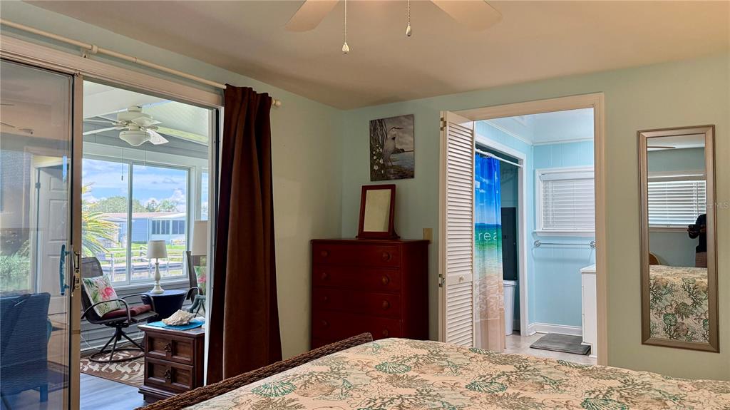 716 Blackburn Boulevard North Port, FL 34287 - Photo 35 of 48 a bedroom with a bed and wooden floor