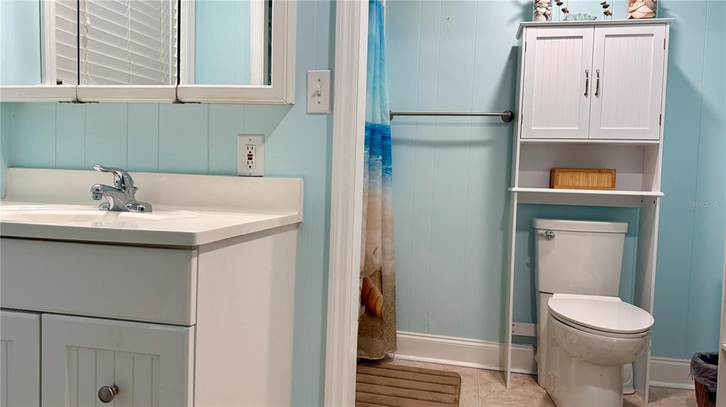 716 Blackburn Boulevard North Port, FL 34287 - Photo 38 of 48 a bathroom with a sink and a mirror