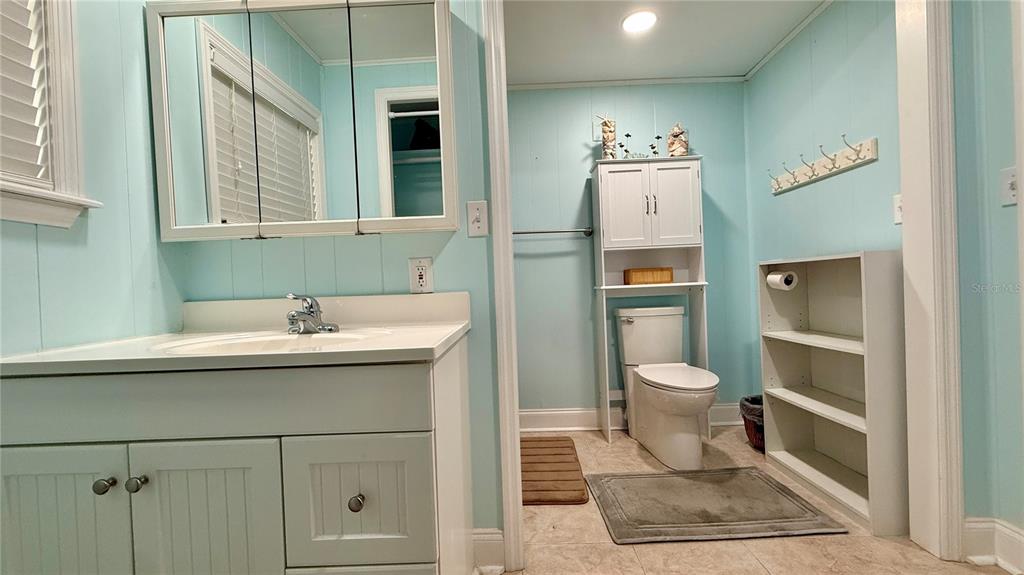 716 Blackburn Boulevard North Port, FL 34287 - Photo 39 of 48 a bathroom with a toilet sink and mirror