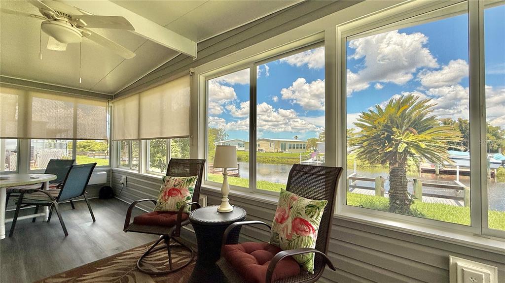 716 Blackburn Boulevard North Port, FL 34287 - Photo 44 of 48 a living room with furniture and floor to ceiling windows