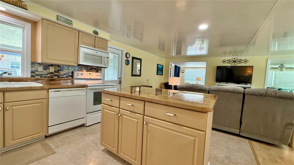 716 Blackburn Boulevard North Port, FL 34287 - Photo 10 of 48 a kitchen with cabinets stainless steel appliances and a sink