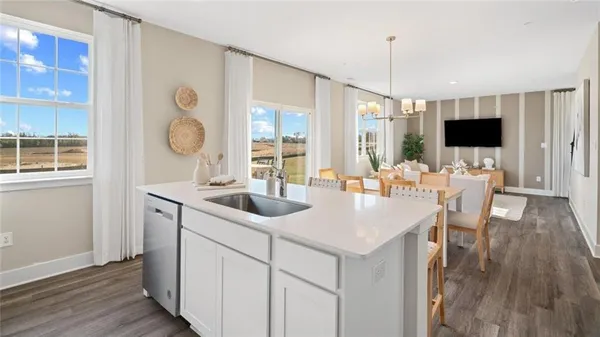 a kitchen with a sink and a refrigerator