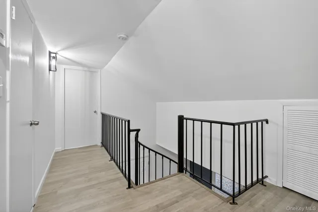 a view of a hallway with windows