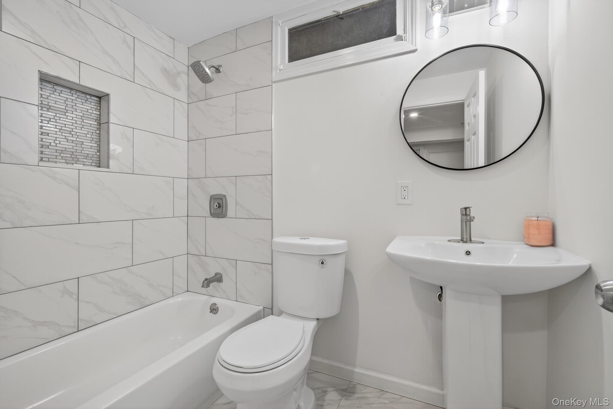 51 Sterling Road Carmel, NY 10512 - Photo 28 of 38 a bathroom with a sink a toilet and a mirror