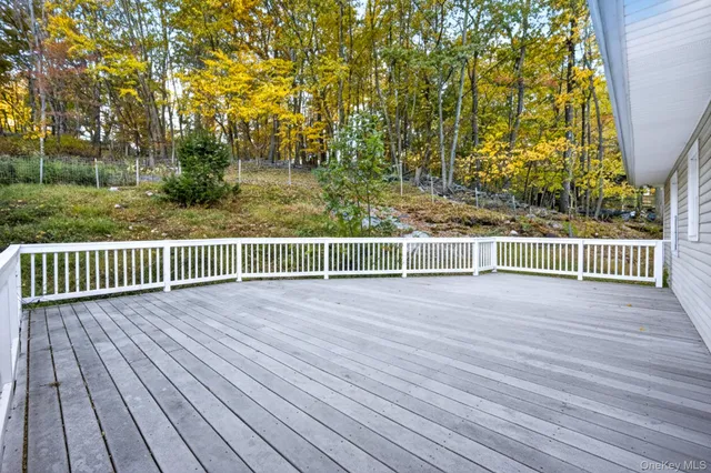a view of a balcony with wooden floor