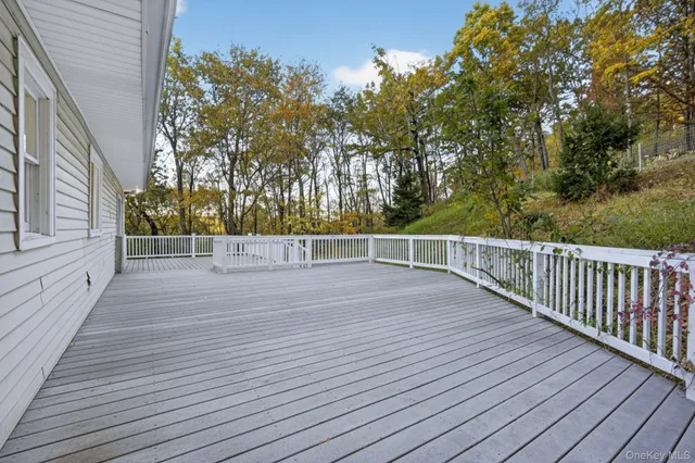 a view of a balcony with wooden floor