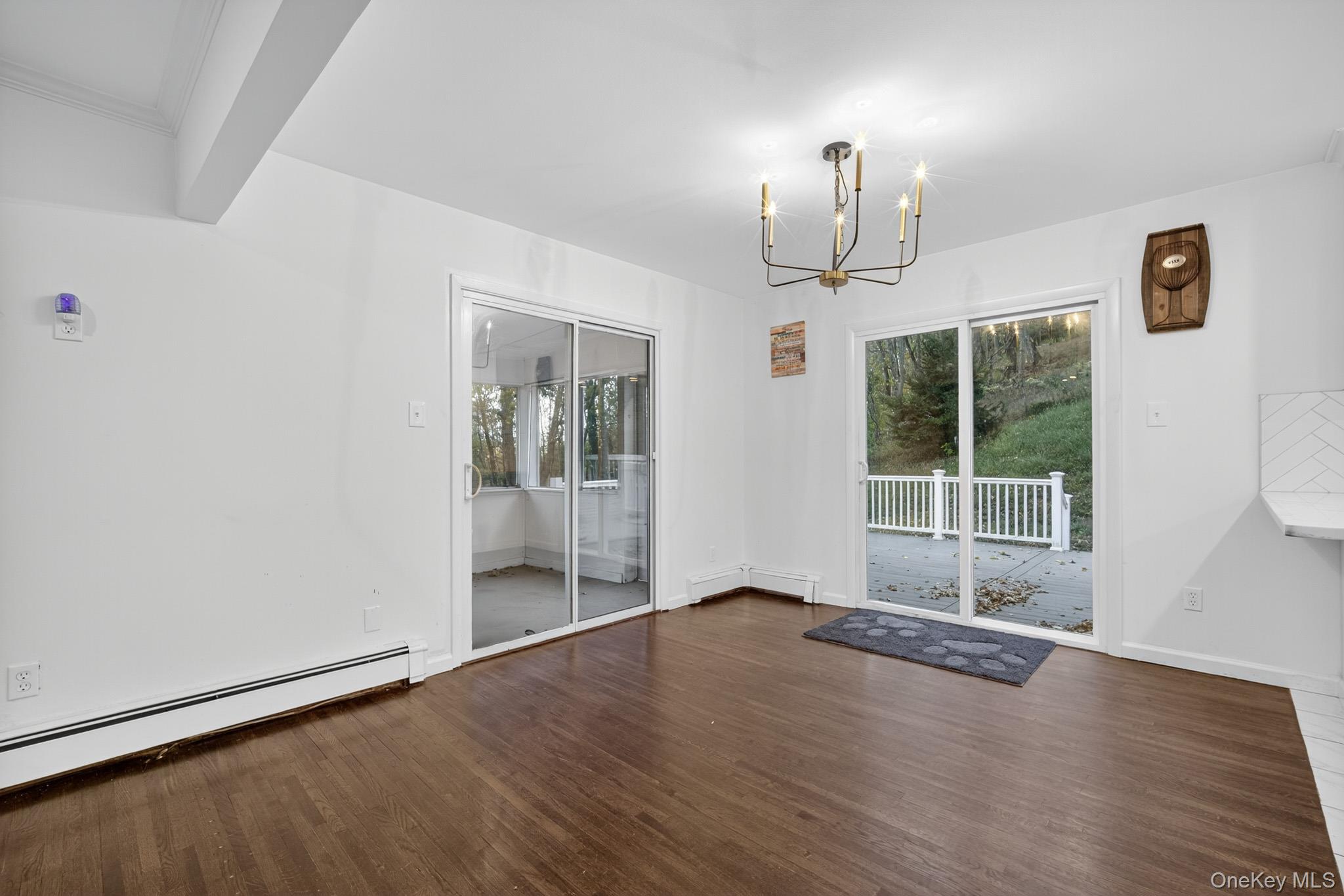 51 Sterling Road Carmel, NY 10512 - Photo 7 of 38 a view of an empty room with wooden floor and a window
