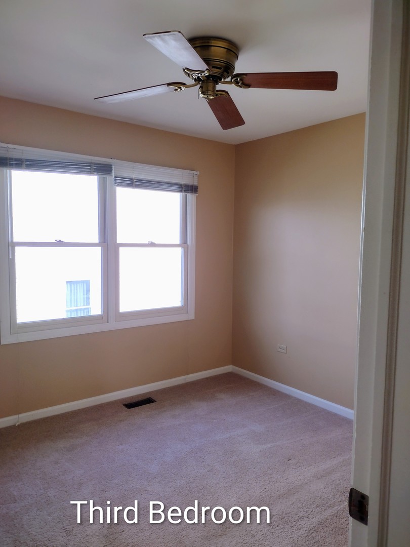 267 Silverado Street Bolingbrook, IL 60490 - Photo 12 of 16 a view of an empty room with a window
