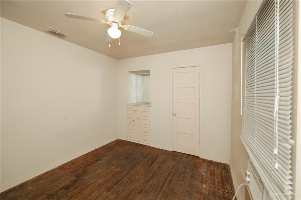 2125 Tucker Road Harlingen, TX 78552 - Photo 13 of 26 a view of empty room with wooden floor and fan