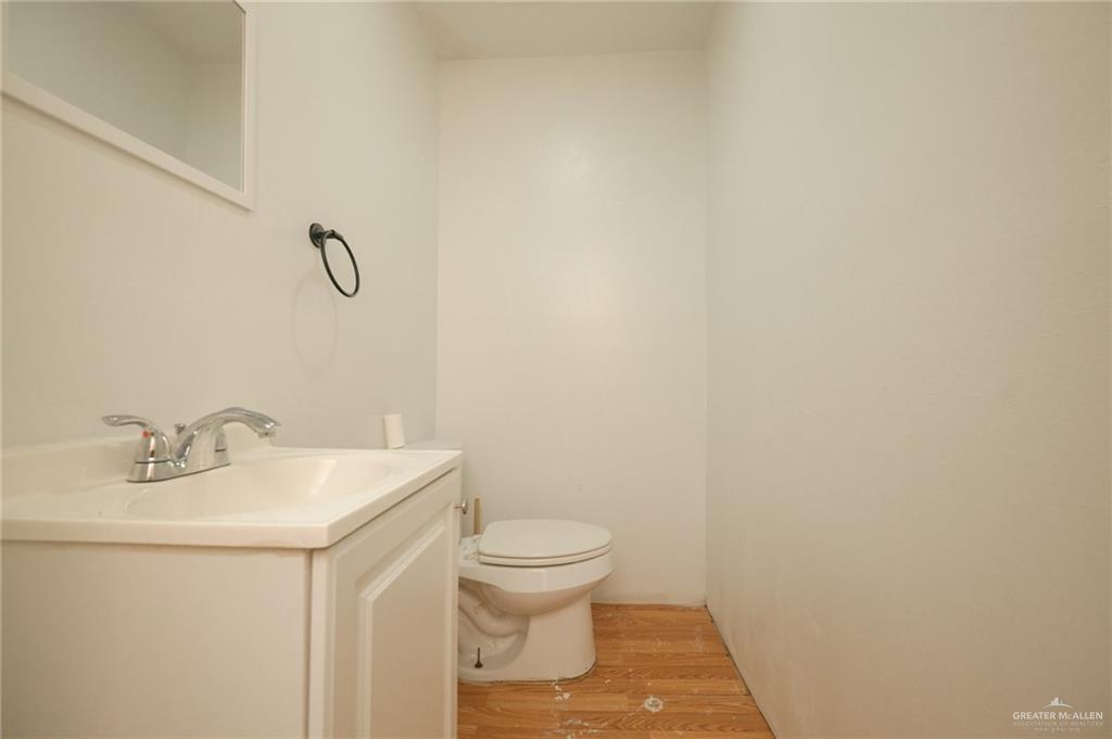 2125 Tucker Road Harlingen, TX 78552 - Photo 19 of 26 a bathroom with a sink a toilet and a mirror