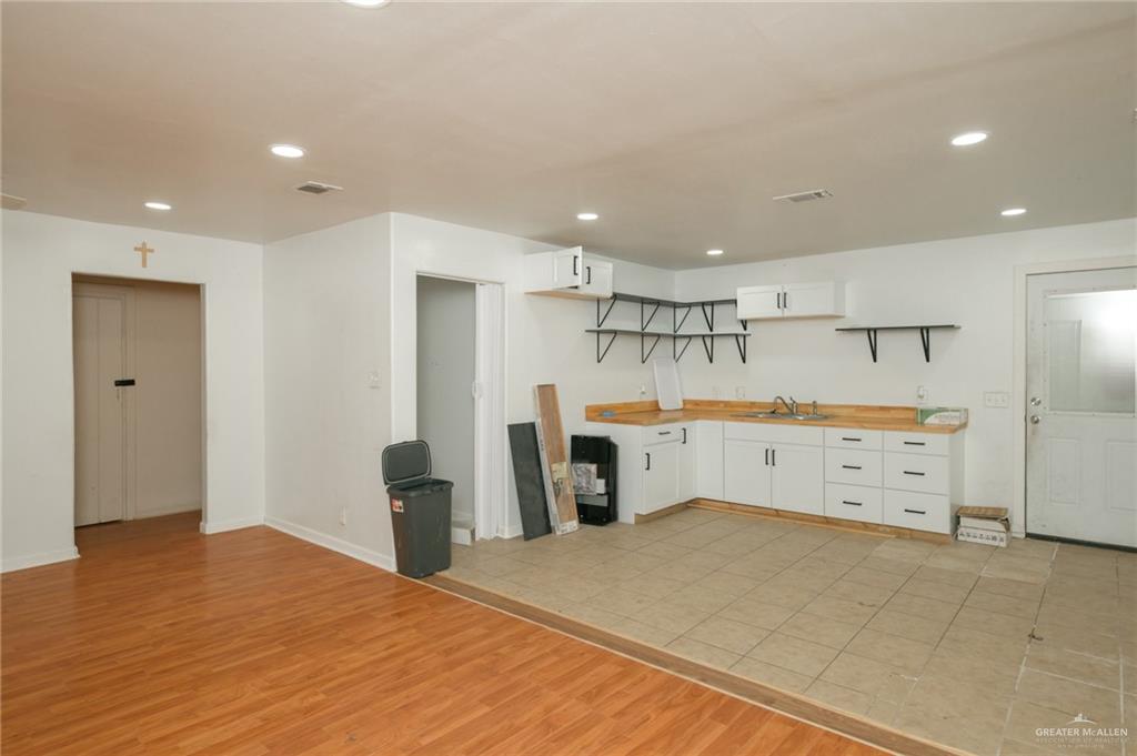 2125 Tucker Road Harlingen, TX 78552 - Photo 4 of 26 a view of a kitchen with furniture and wooden floor