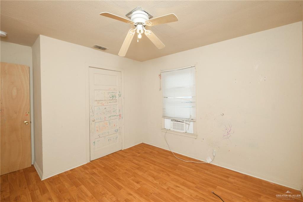 2125 Tucker Road Harlingen, TX 78552 - Photo 6 of 26 a view of empty room with wooden floor