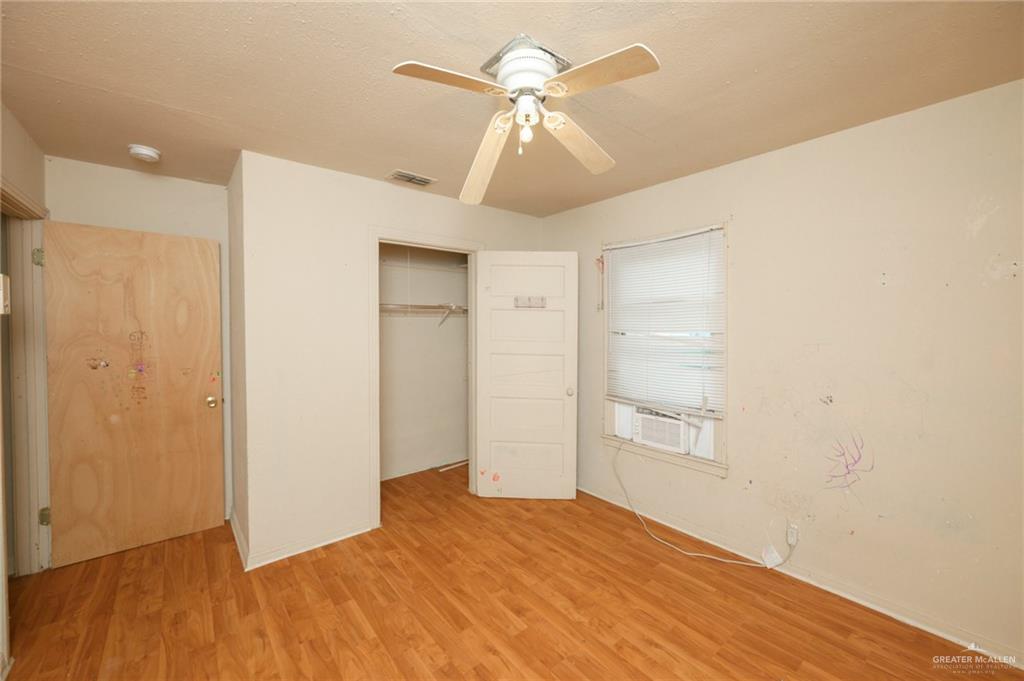 2125 Tucker Road Harlingen, TX 78552 - Photo 7 of 26 a view of empty room with wooden floor