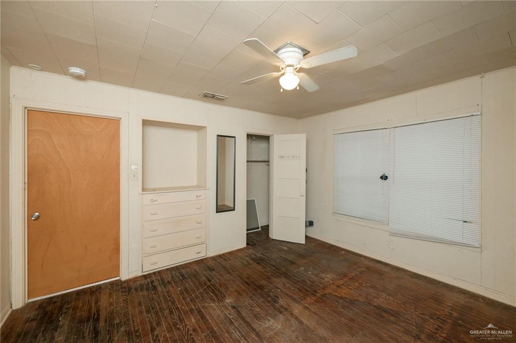 2125 Tucker Road Harlingen, TX 78552 - Photo 10 of 26 wooden floor in an empty room with a window
