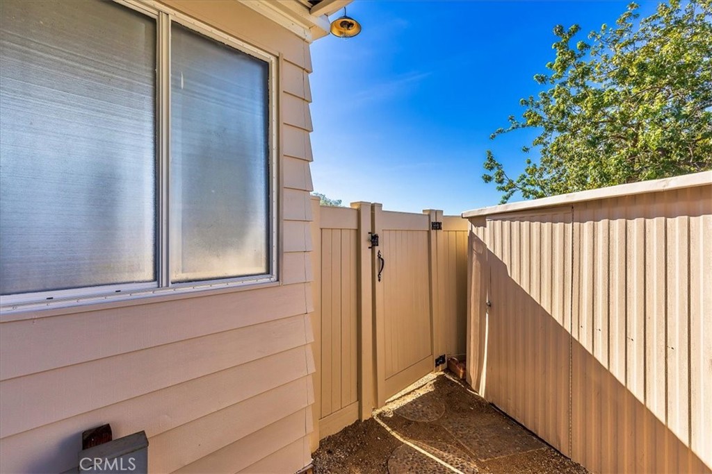 31130 South General Kearny Road, Unit 134 Temecula, CA 92591 - Photo 29 of 54 Vinyl fencing and gate into back yard.