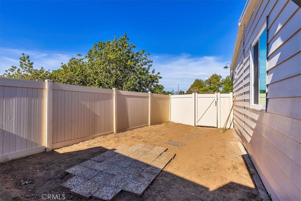 31130 South General Kearny Road, Unit 134 Temecula, CA 92591 - Photo 31 of 54 Vinyl fencing in back yard. New exterior paint on home.