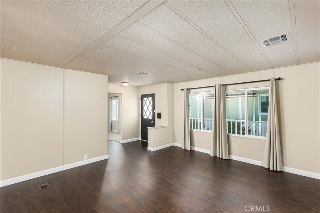 31130 South General Kearny Road, Unit 134 Temecula, CA 92591 - Photo 4 of 54 Family room with hard surface flooring. Front door entry.