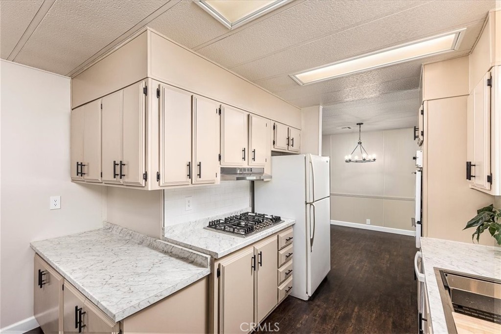 31130 South General Kearny Road, Unit 134 Temecula, CA 92591 - Photo 6 of 54 other side of kitchen that adjoins dining area. New counter tops.