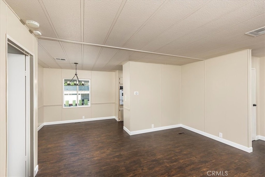 31130 South General Kearny Road, Unit 134 Temecula, CA 92591 - Photo 8 of 54 Dining area with new lighting. Opens to family room and kitchen.