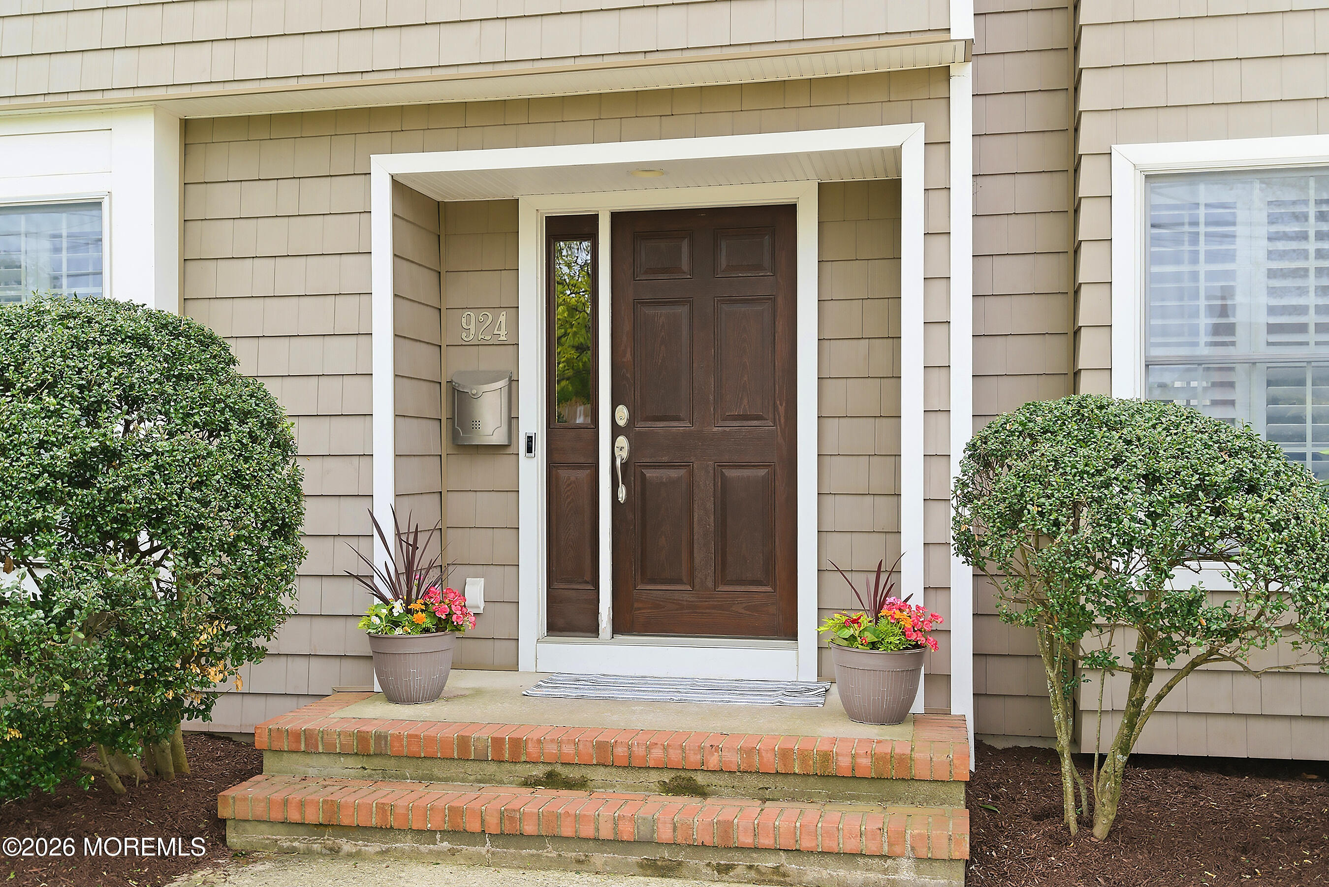 924 Ocean Road Point Pleasant, NJ 08742 - Photo 4 of 56 a house with a potted plant in front of door