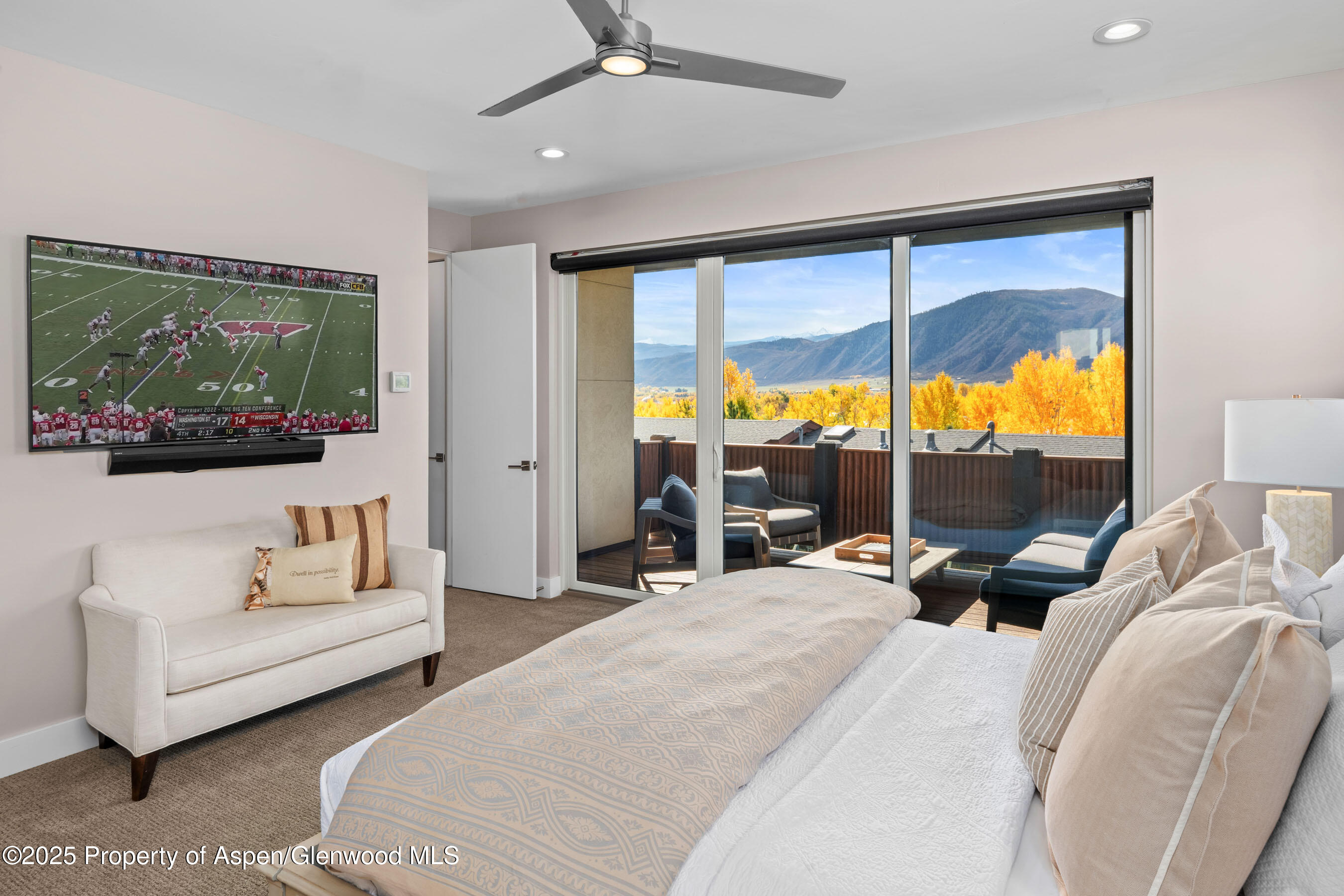 250 Overlook Ridge, Unit 250 Carbondale, CO 81623 - Photo 13 of 41 a bedroom with furniture and large windows