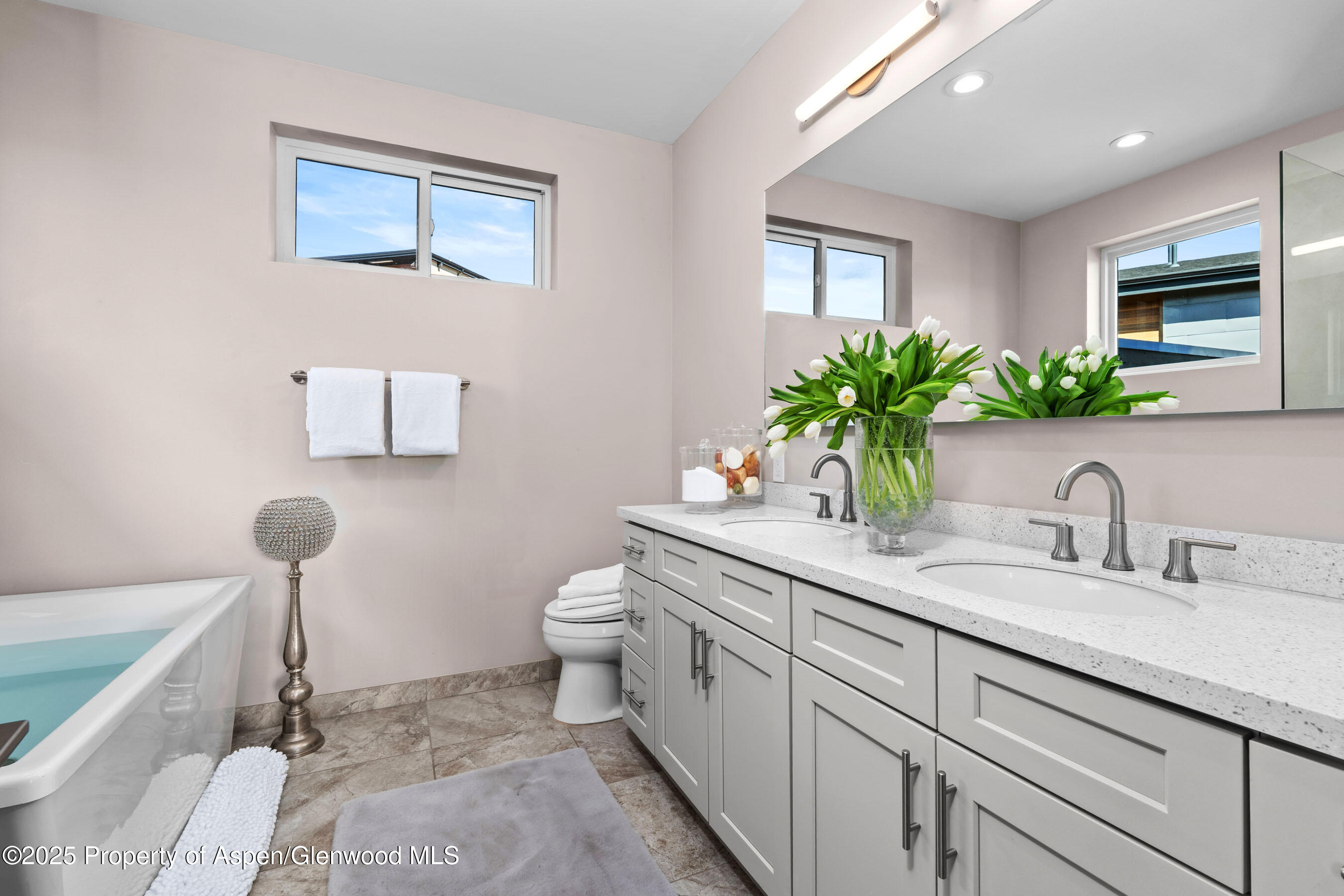 250 Overlook Ridge, Unit 250 Carbondale, CO 81623 - Photo 14 of 41 a bathroom with a granite countertop sink toilet and a mirror
