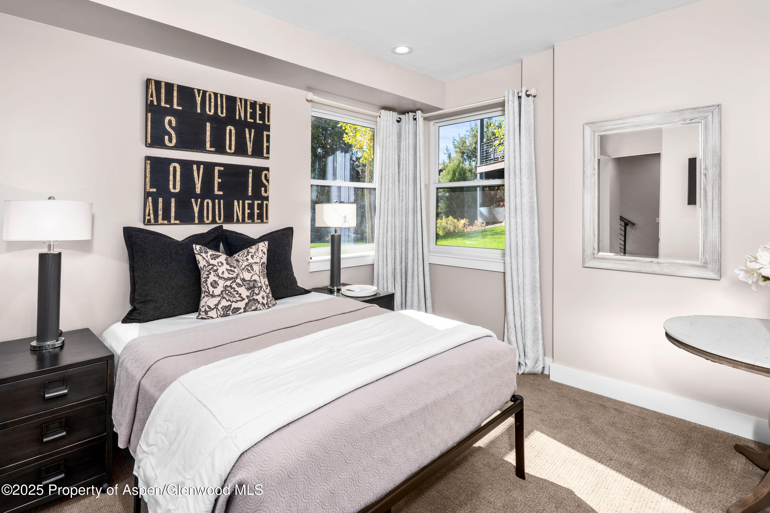 250 Overlook Ridge, Unit 250 Carbondale, CO 81623 - Photo 25 of 41 a bedroom with a bed and a window