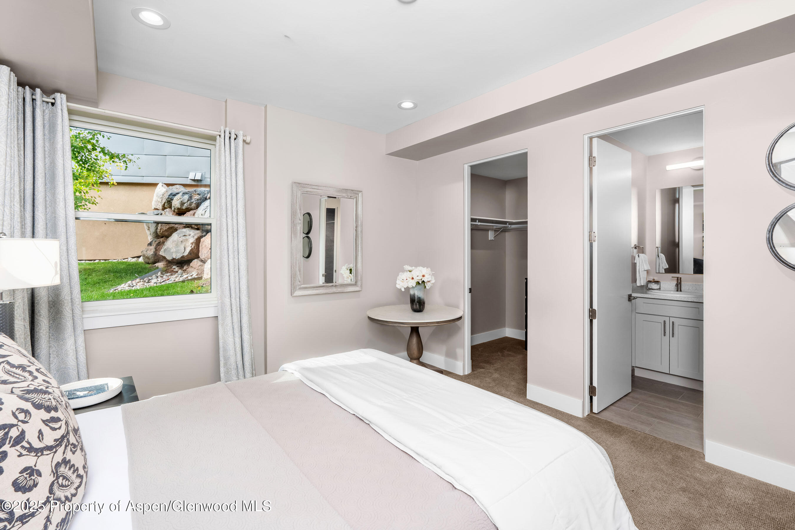 250 Overlook Ridge, Unit 250 Carbondale, CO 81623 - Photo 26 of 41 a bedroom with a bed and a window