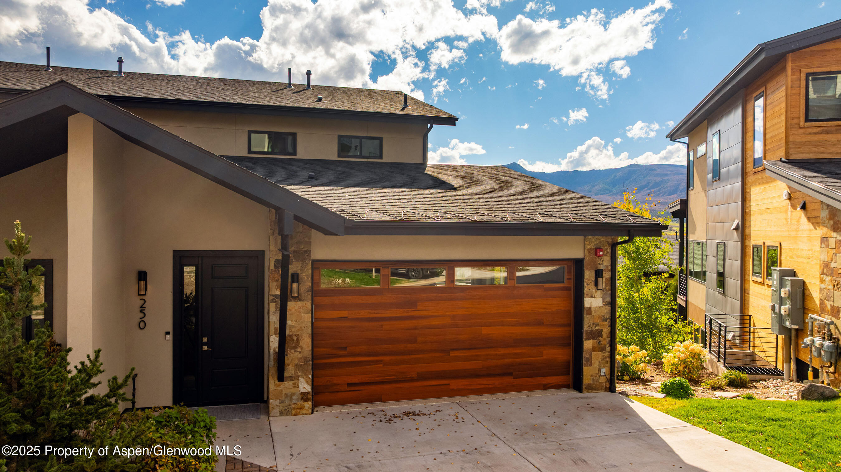 250 Overlook Ridge, Unit 250 Carbondale, CO 81623 - Photo 29 of 41 a front view of a house with a garden