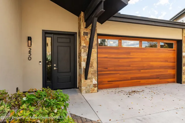 a view of a door and an empty room
