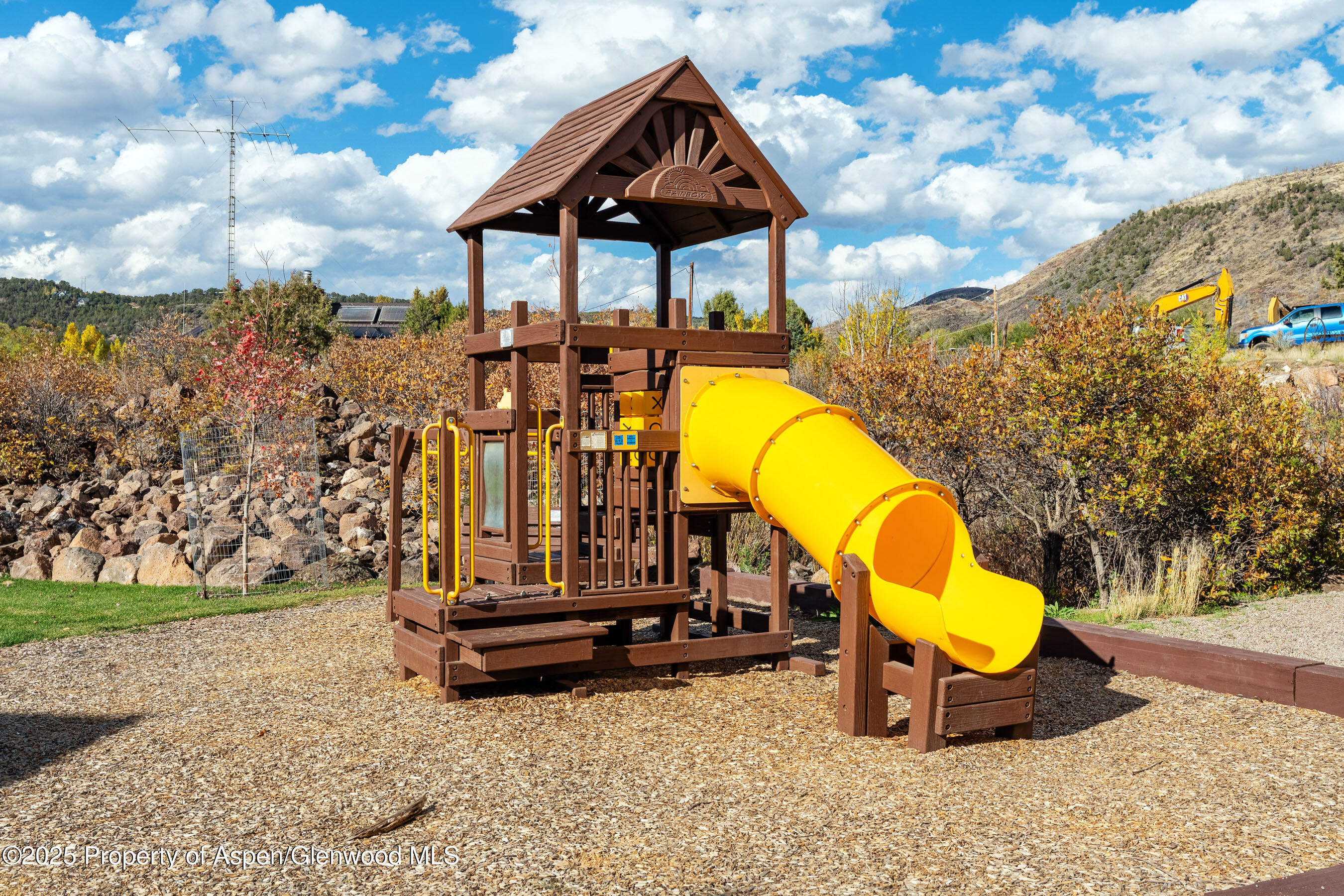 250 Overlook Ridge, Unit 250 Carbondale, CO 81623 - Photo 33 of 41 a view of a swimming pool with a bench and yard
