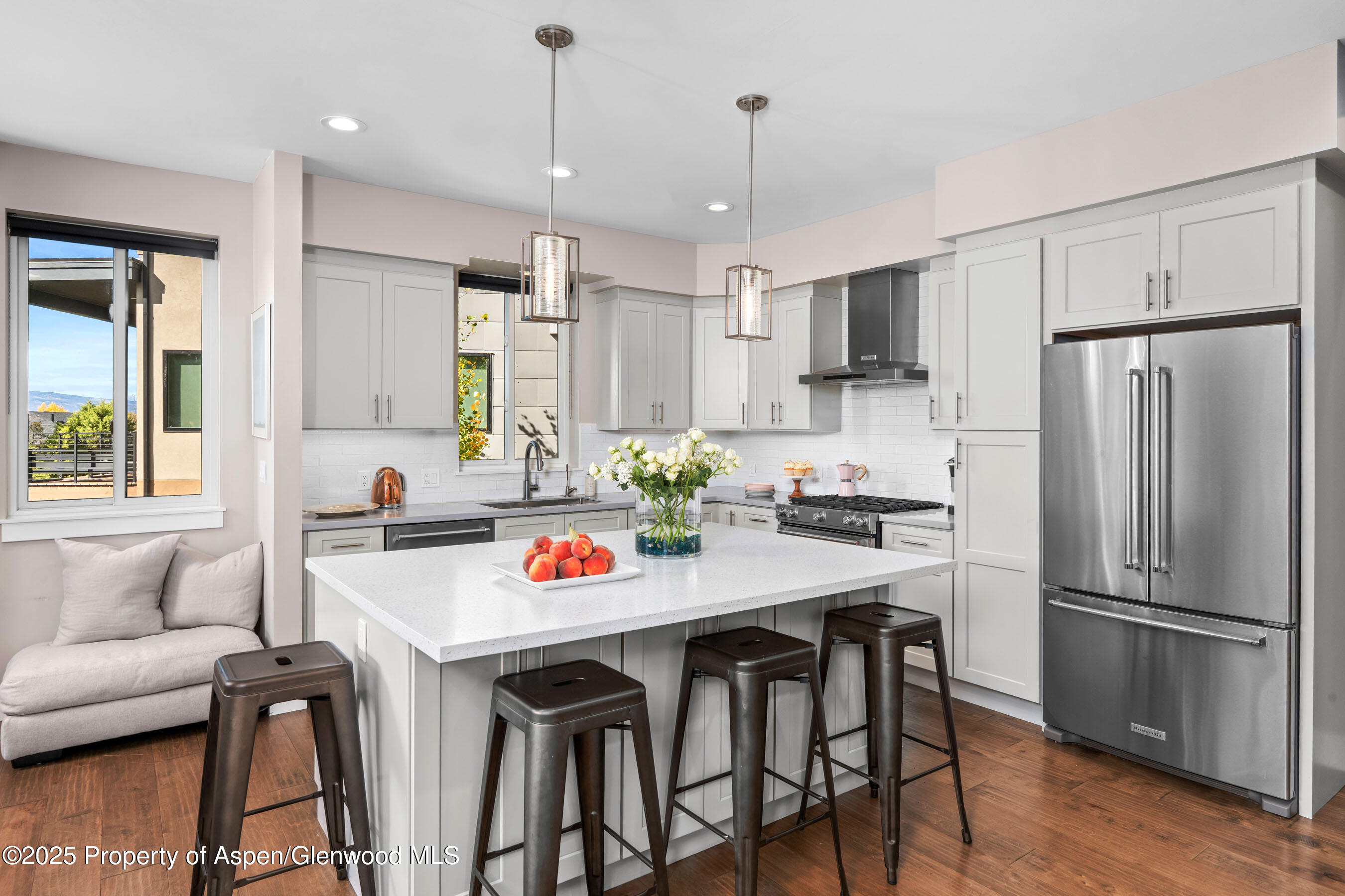 250 Overlook Ridge, Unit 250 Carbondale, CO 81623 - Photo 7 of 41 a kitchen with stainless steel appliances granite countertop a dining table chairs refrigerator and microwave