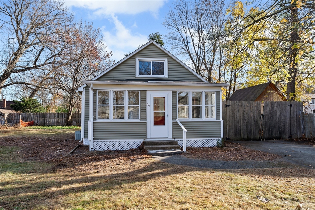 195 Almira Road Springfield, MA 01119 - Photo 1 of 41 a front view of a house with a yard and garage