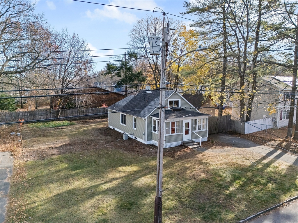 195 Almira Road Springfield, MA 01119 - Photo 2 of 41 a view of a house with a yard covered in snow