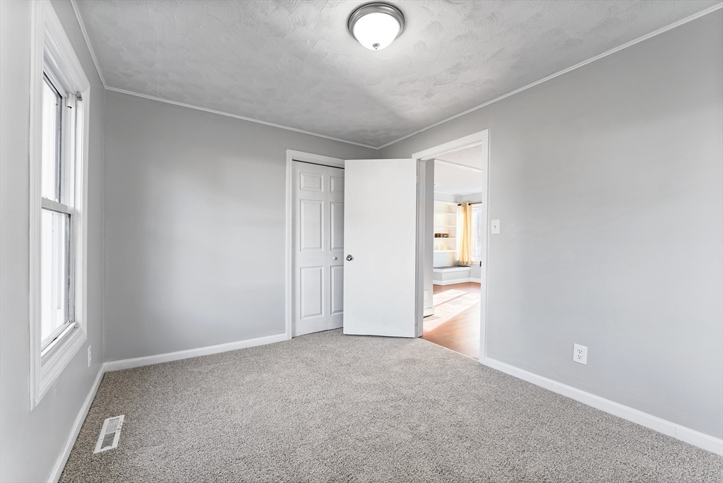 195 Almira Road Springfield, MA 01119 - Photo 23 of 41 an empty room with windows and closet