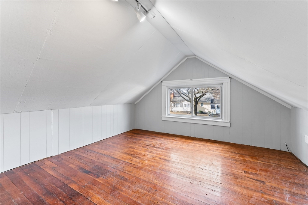 195 Almira Road Springfield, MA 01119 - Photo 28 of 41 a view of an empty room with wooden floor and a window