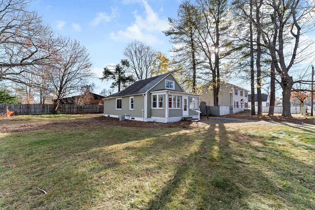 195 Almira Road Springfield, MA 01119 - Photo 36 of 41 a view of a yard with a house and a large tree