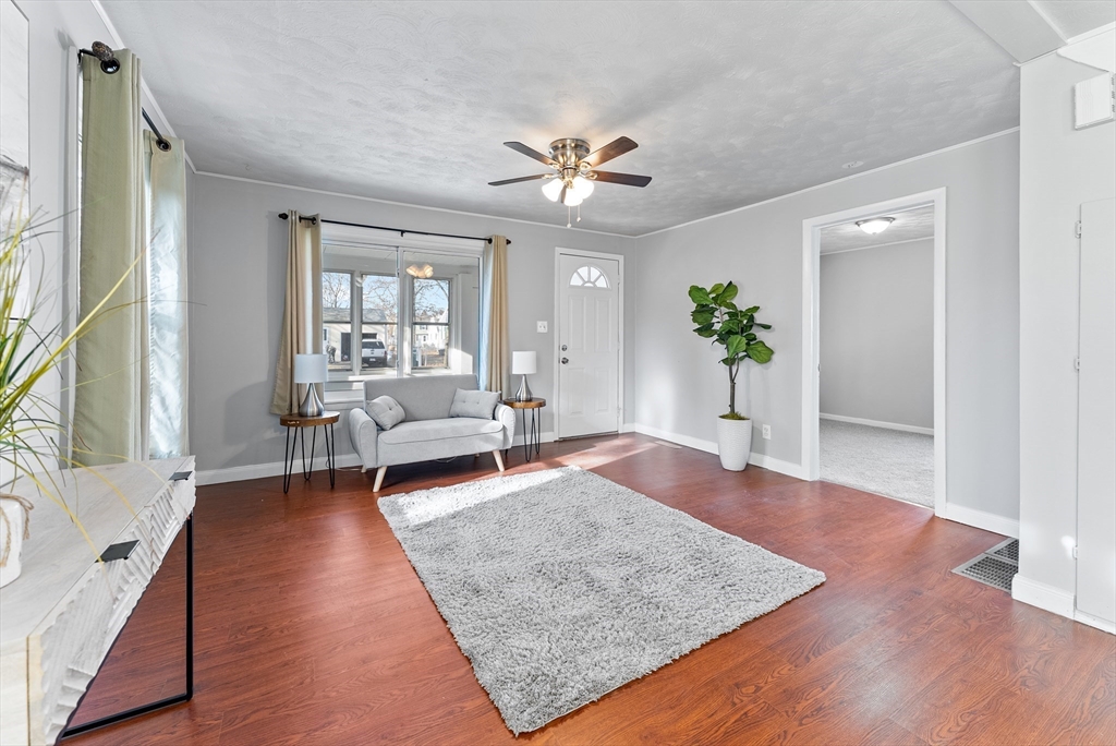 195 Almira Road Springfield, MA 01119 - Photo 9 of 41 a living room with furniture and a wooden floor