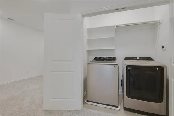 a utility room with washer and dryer