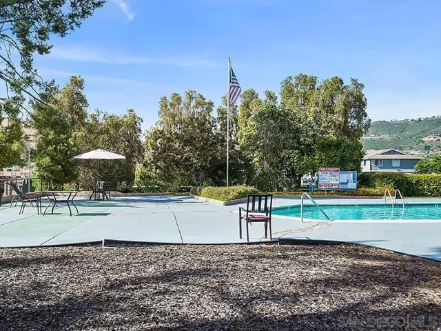 a view of a park with large trees
