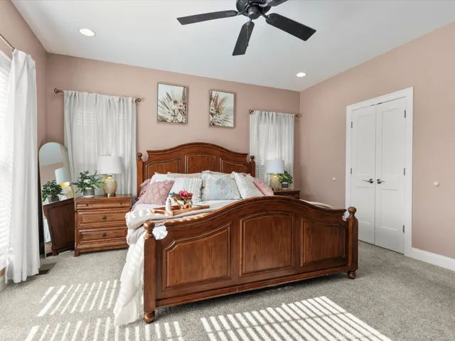 a bedroom with a bed and window