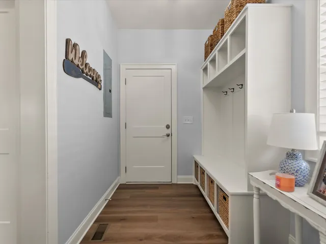 a view of an entryway with wooden floor