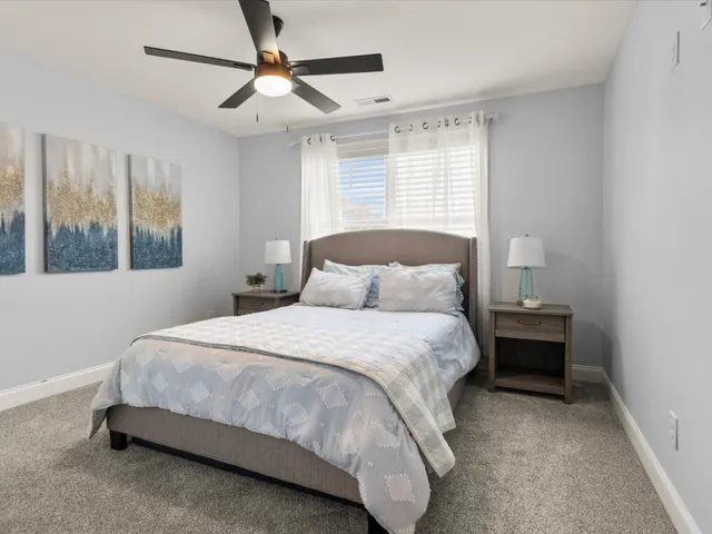 a bedroom with a bed and window