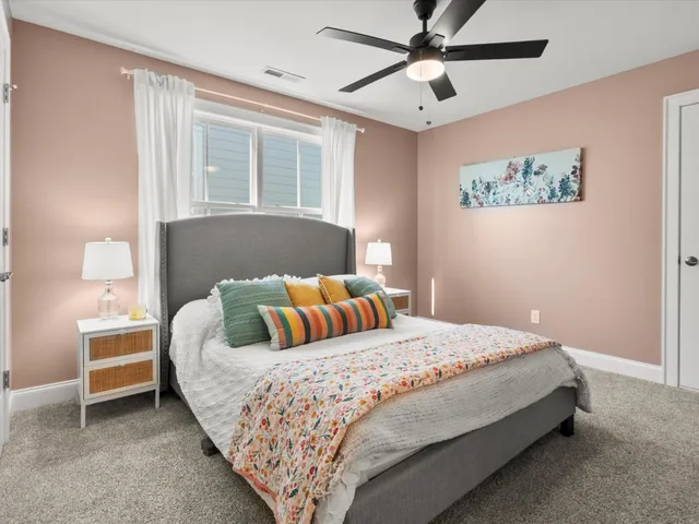 a bedroom with bed and a window