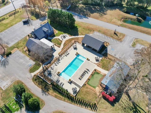 an aerial view of a house with outdoor space