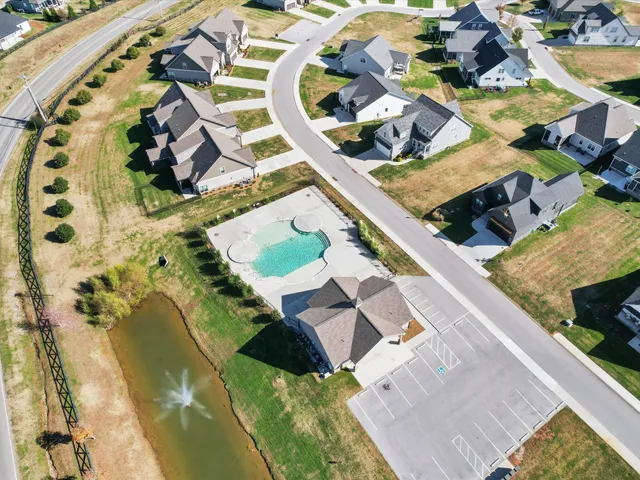 an aerial view of a house with a swimming pool