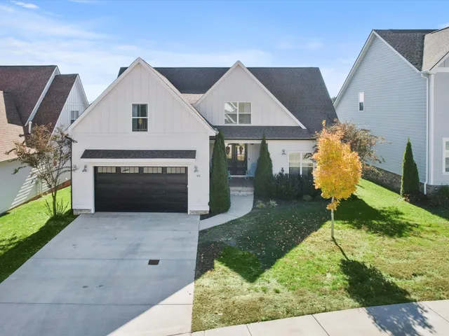 a swimming pool with yard in front of it