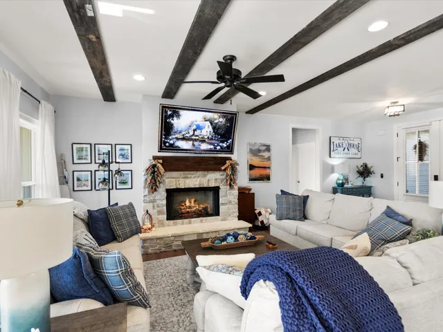 a living room with furniture and a fireplace